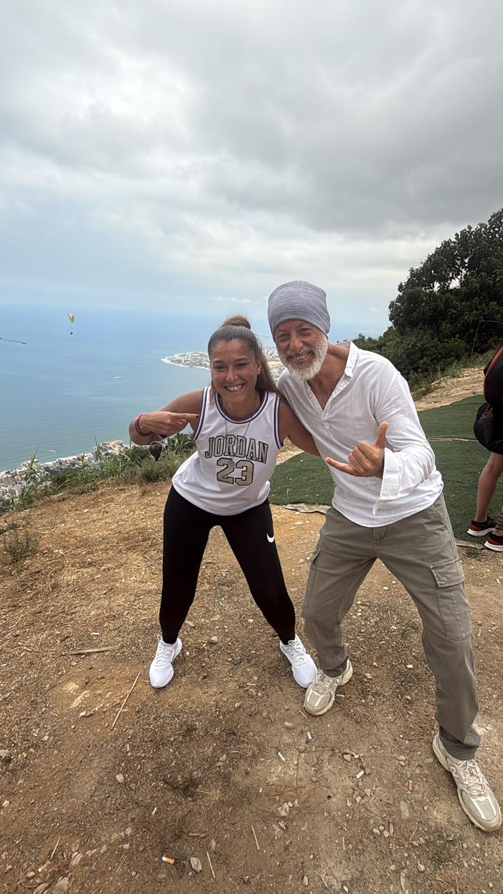 Passenger and pilot celebrating at the launch site above the Jounieh coastline
